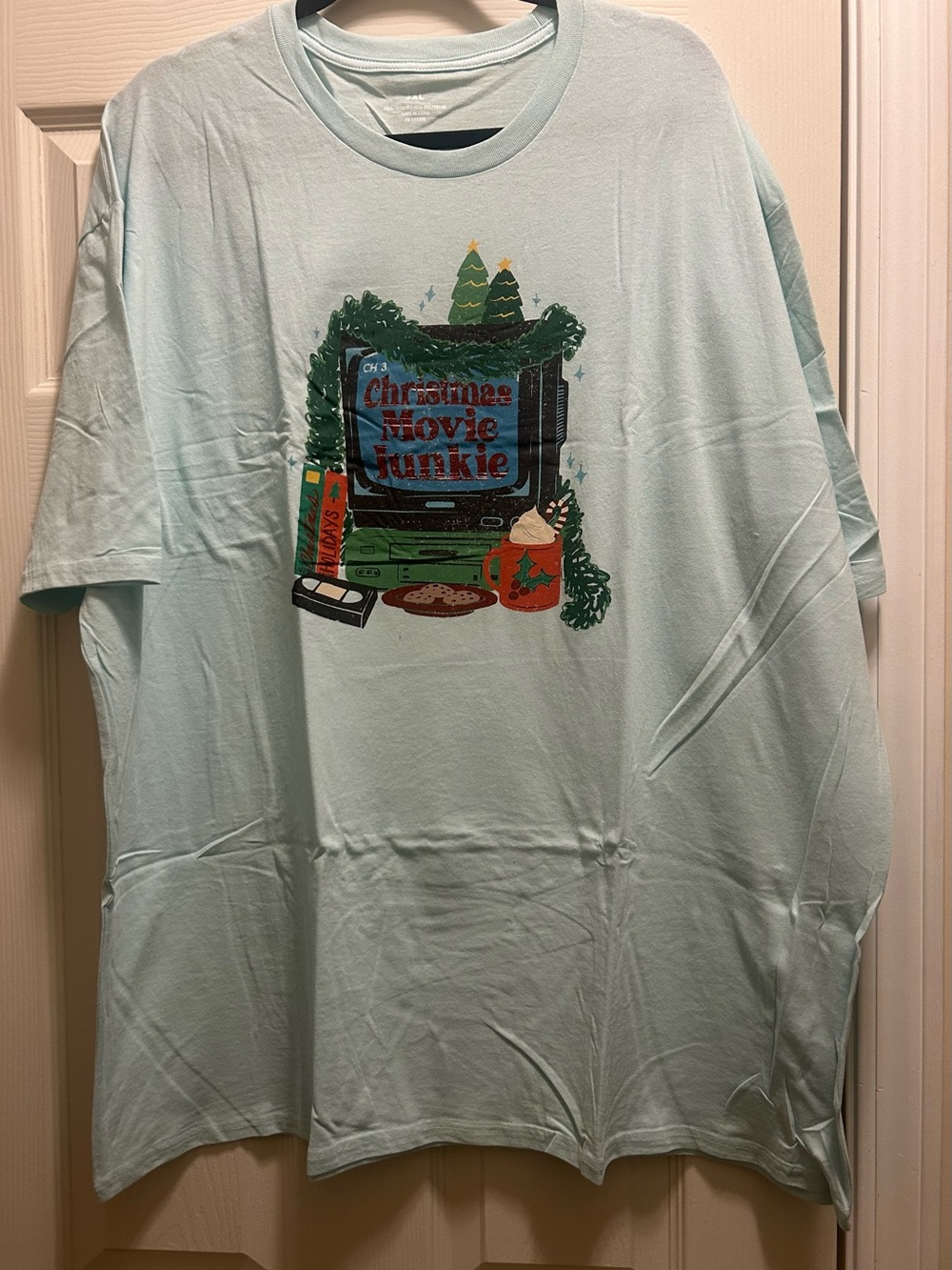 Unisex Christmas Movie Junkie Graphic Tee - Light Mint Green. Size 3XL